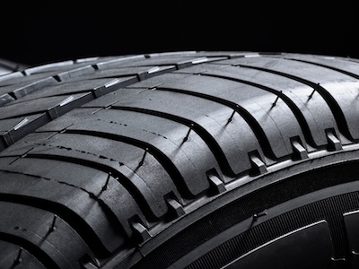 Tires ot tyres in a row on black background
